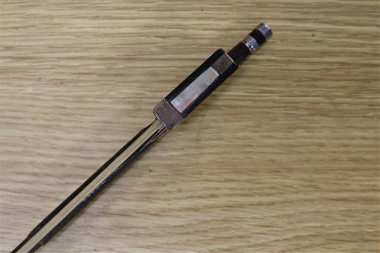 A silver mounted violin bow, an ivory mounted violin bow and a late 19th century German violin, cased